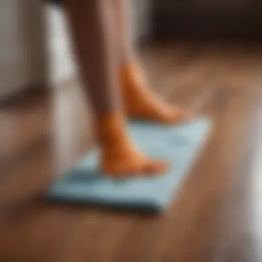 Close-up of a person cleaning baseboards with a microfiber cloth