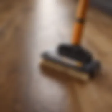 A variety of hardwood floor cleaning tools displayed on a wooden surface