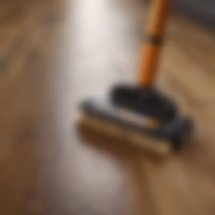 A variety of hardwood floor cleaning tools displayed on a wooden surface