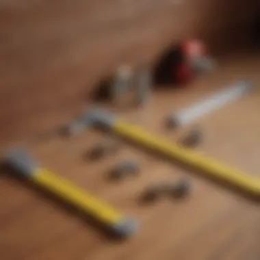 An array of tools essential for locating wooden studs, including a level, measuring tape, and pencil.