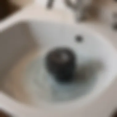 Close-up view of hair clogging a sink drain