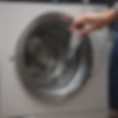 Vinegar being poured into a washing machine drum